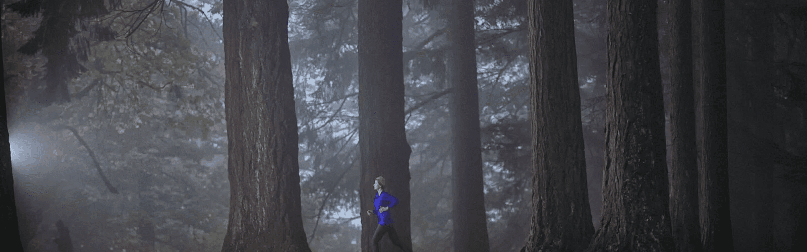 woman jogging in forest